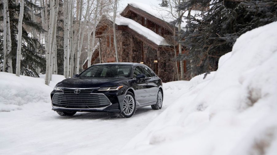 The 2021 Toyota Avalon Limited sedan parked on a snowy driveway