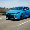 A blue 2021 Toyota Corolla Hatchback driving down an empty road, the 2021 Toyota Corolla Hatchback is one of the least reliable Toyota models