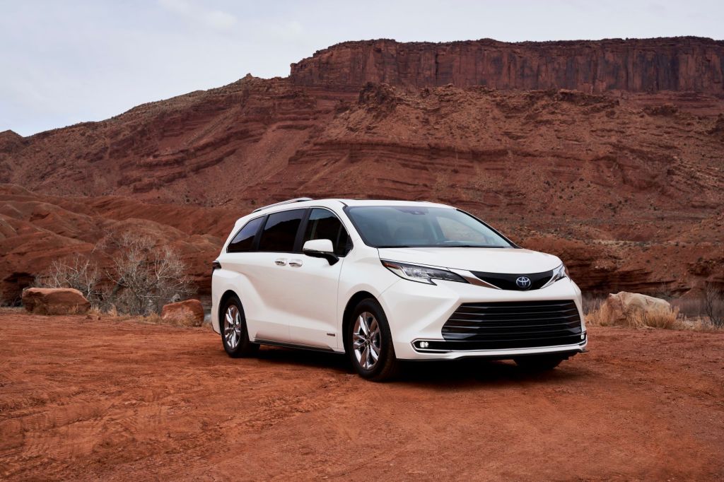 A white 2021 Toyota Sienna in a desert area.