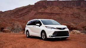 A white 2021 Toyota Sienna in a desert area.