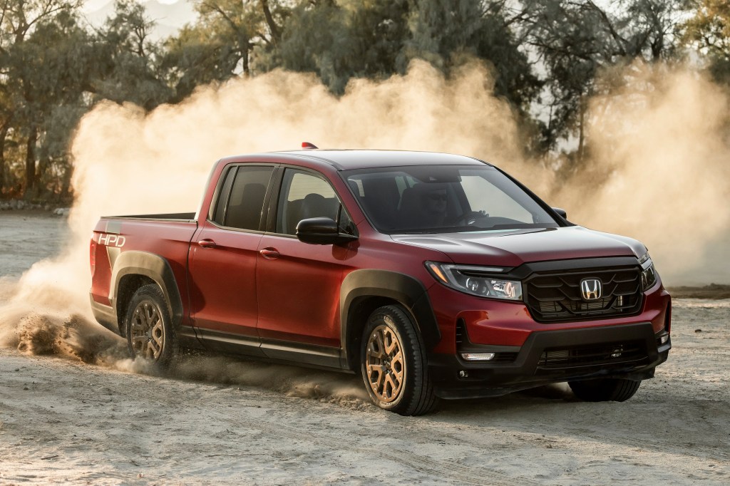 A burgundy 2021 Ridgeline Sport with HPD Package. 