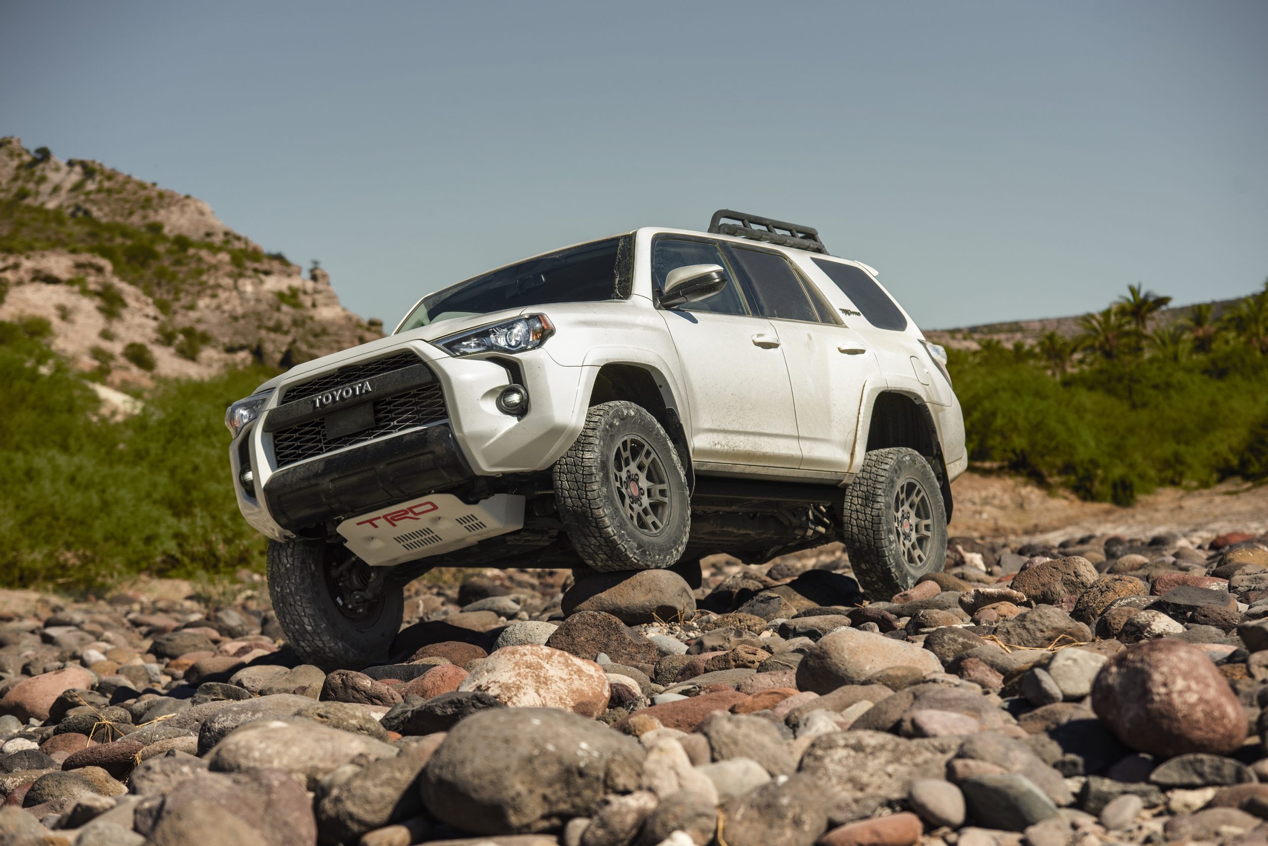 A Toyota 4Runner, one of the fastest selling new cars, climbs some rocks for press photos