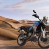 A white-blue-and-red 2022 Aprilia Tuareg 660 in the desert