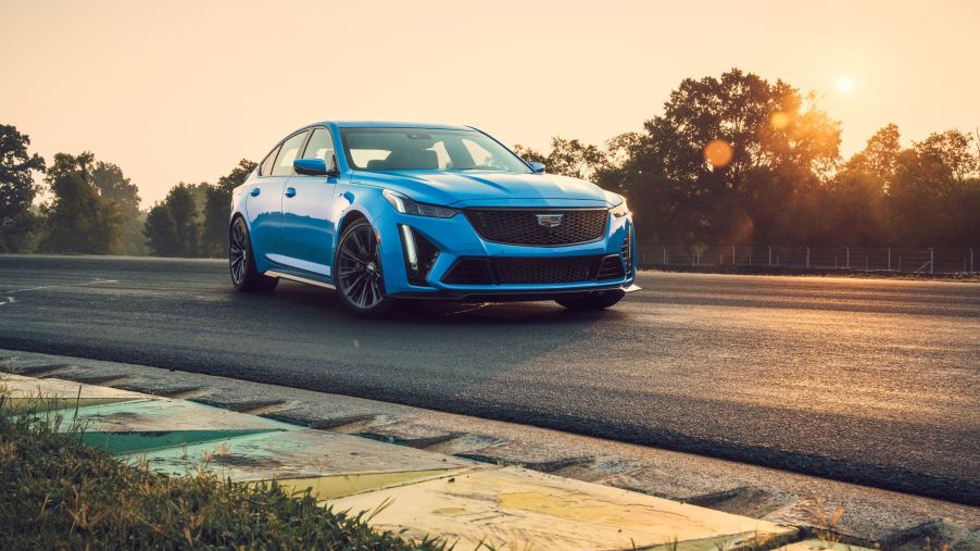 A blue 2022 Cadillac CT5-V Blackwing parked on a racetrack corner