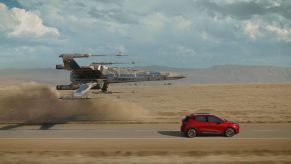 The Chevy Bolt EUV racing a Star Wars X-Wing Fighter in the 'Magic is Electric' Disney commercial
