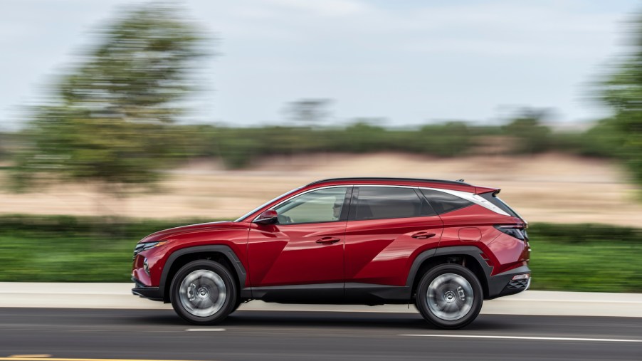 A red 2022 Hyundai Tucson driving