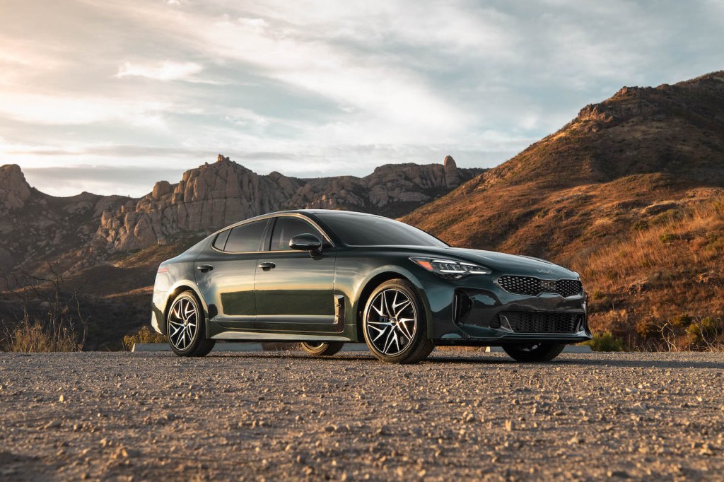 A 2022 Kia Stinger parked in the wilderness, the 2022 Kia Stinger is one of the least reliable new kia models