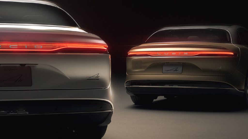 The rear view of a silver and a gold 2022 Lucid Air Dream Edition