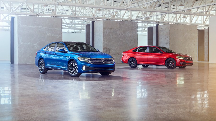 The 2022 Volkswagen Jetta (left in blue color) and Jetta GLI (right in red color).