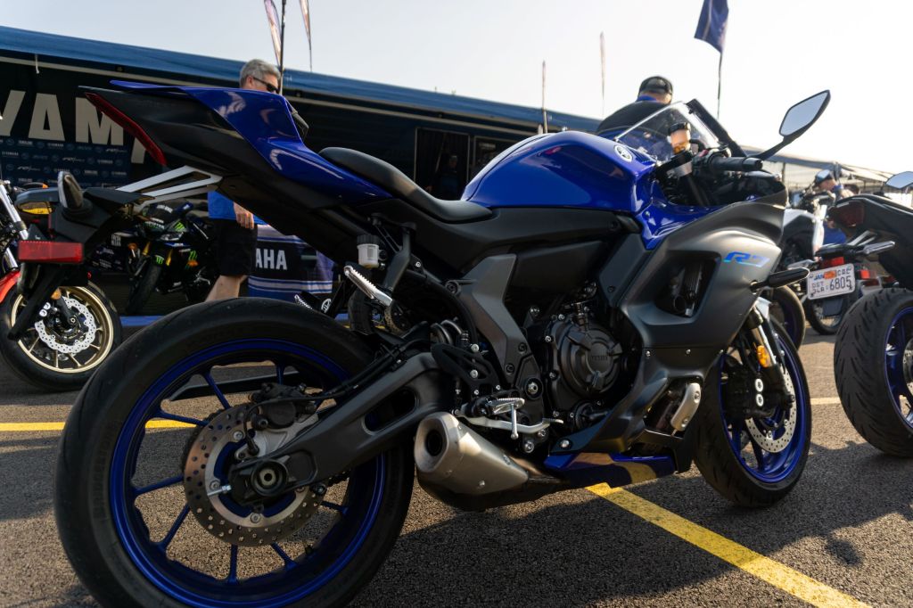 A right-side rear 3/4 view of a blue-and-black 2022 Yamaha YZF-R7