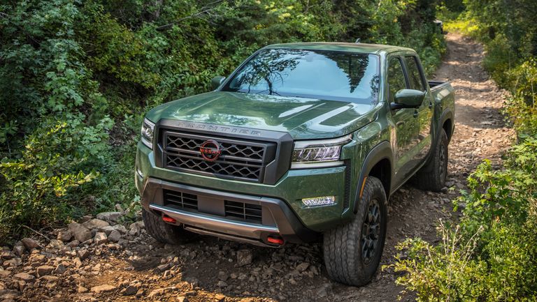 The 2022 Nissan Frontier Pro-4X off-roading in the woods