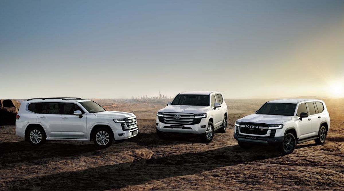 a trio of 2022 Toyota Land Cruisers parked in a desert field