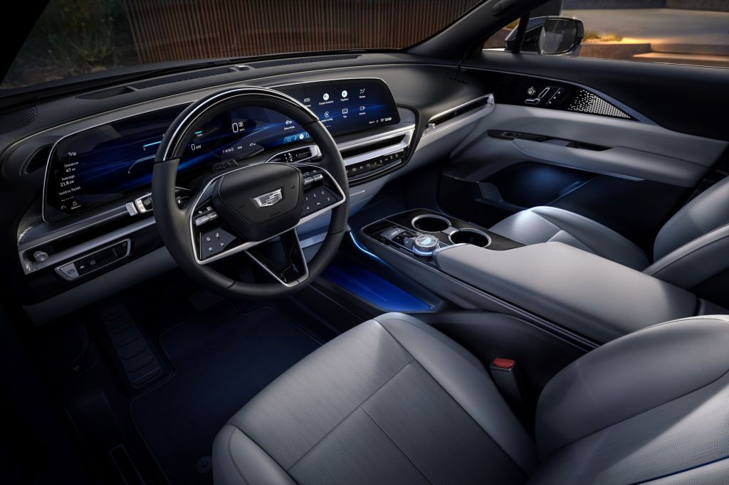 The gray front seats and black dashboard of a 2023 Cadillac Lyriq