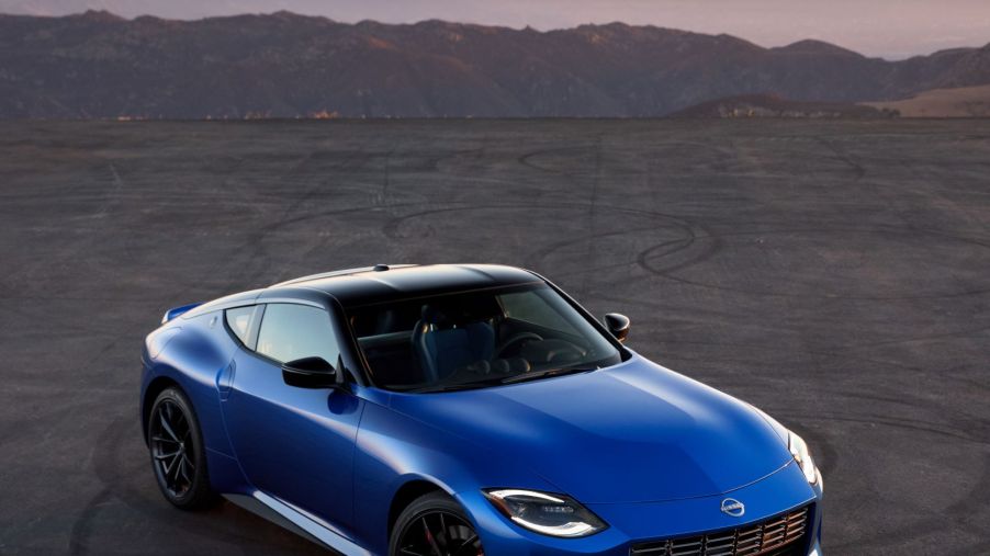 An overhead view of a blue 2023 Nissan Z on a mountainside road
