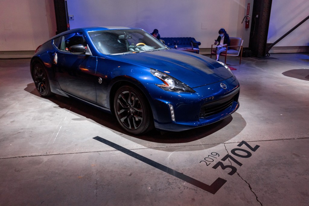 A blue Nissan 370 Z at the debut of Nissan's new Z car