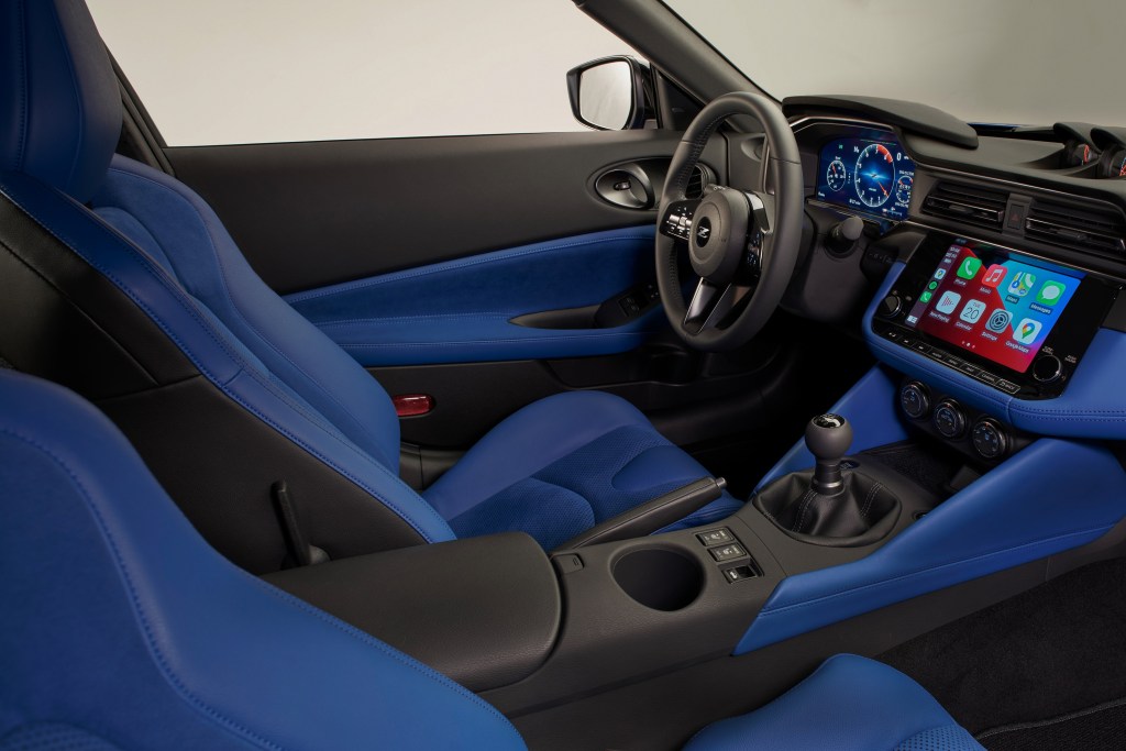 The interior of Nissan's new Z, complete with Carplay and stick shift