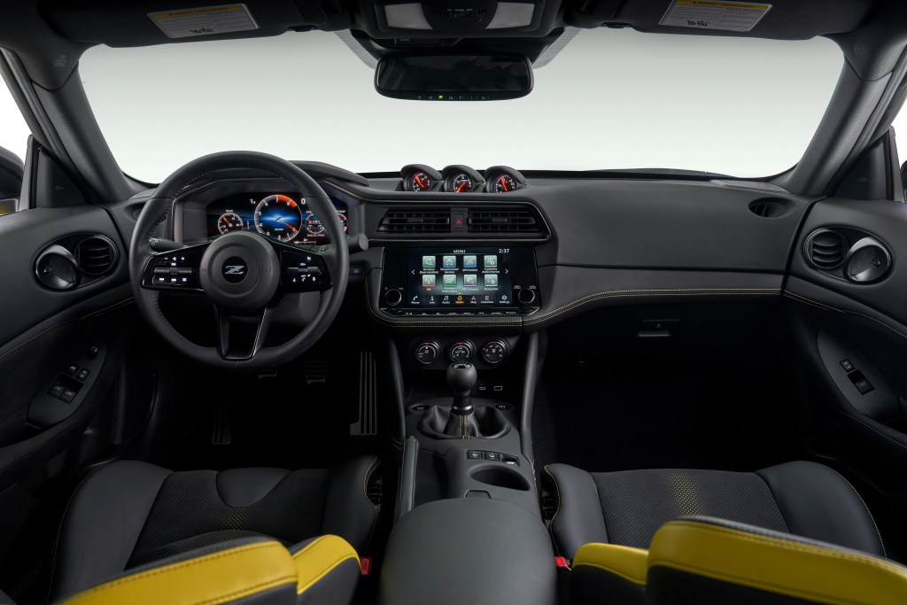 The yellow-accented interior of the new Z coupe, with manual transmission