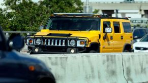 The AM General Hummer in yellow driving in Miami, Florida