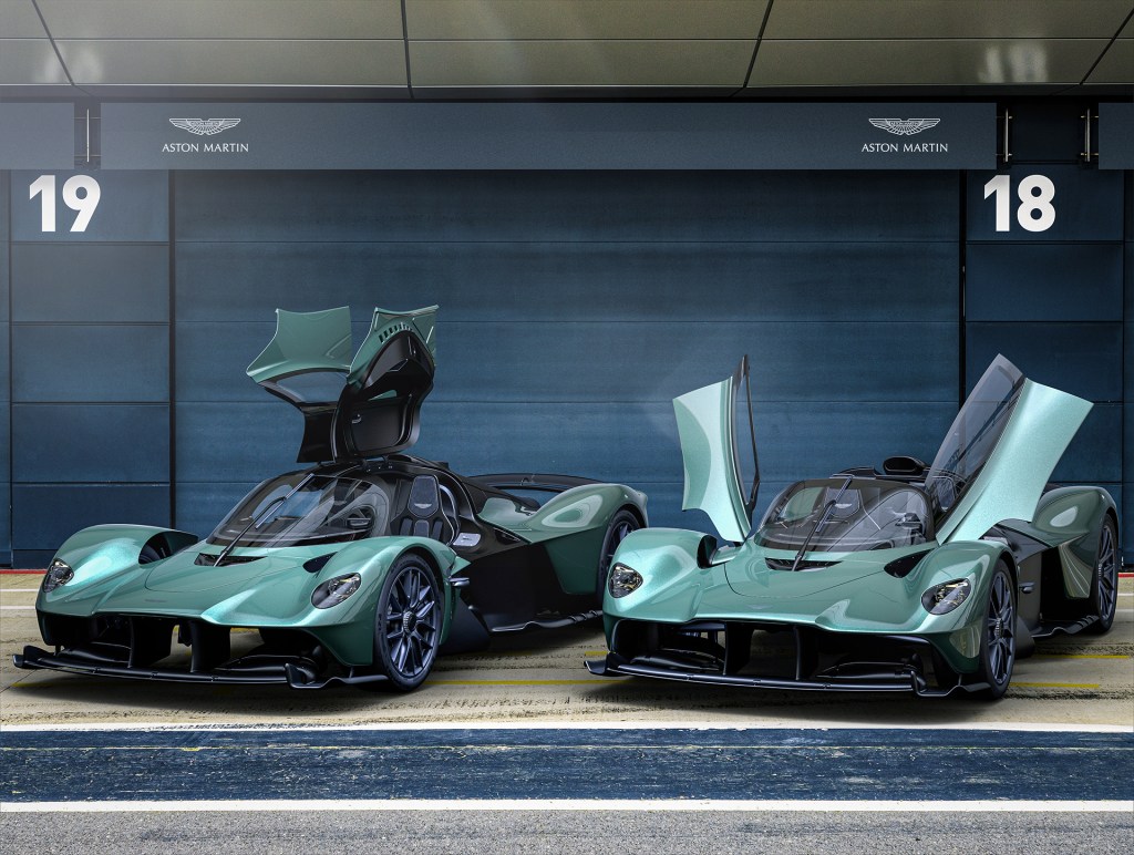 The Aston Martin Valkyrie Spider parked next to the Aston Martin Valkyrie coupe.