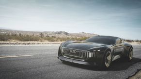 The Audi Skysphere concept car model parked on the side of a country highway