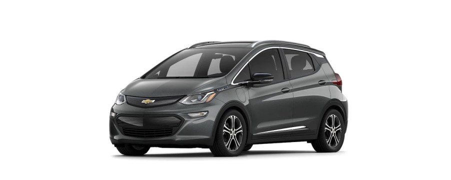 A dark gray 2021 Chevy Bolt against a white background.