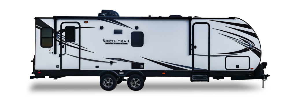 a North Trail travel trailer in a press photo against a white backdrop