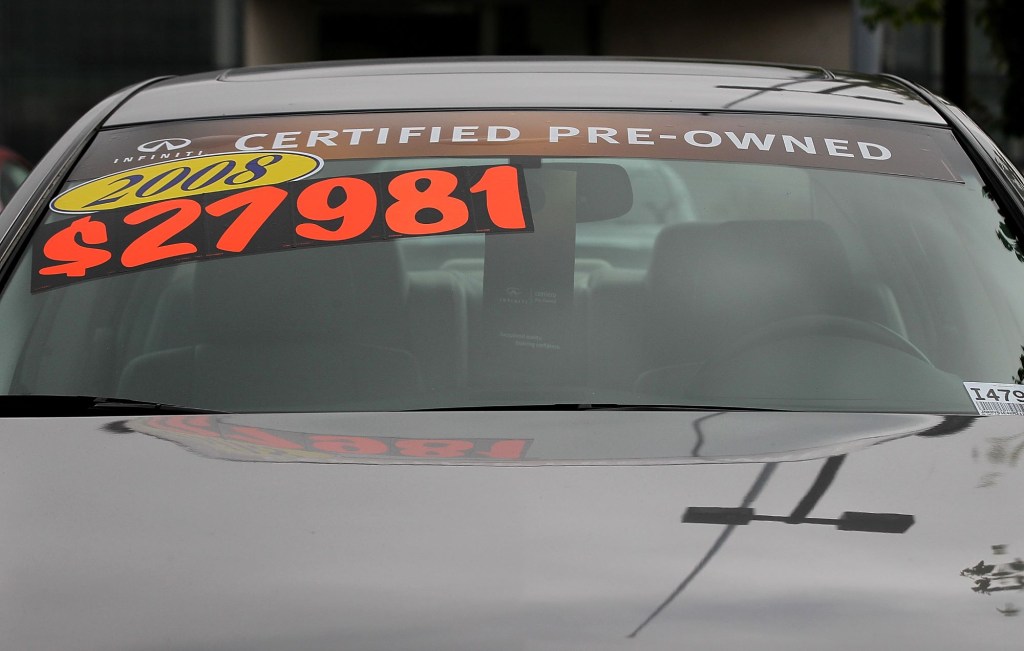 A price sticker on an Infiniti model in a user car lot in San Rafael, California