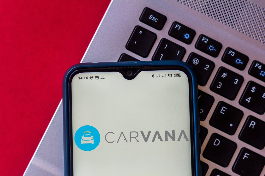 Carvana logo displayed on a smartphone