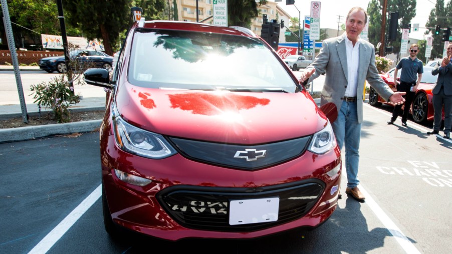 Congressman Adam Schiff plugs in his Chevy Bolt during the unveiling of new electric vehicle charging ports in Downtown Burbank on Monday, July 12, 2021.