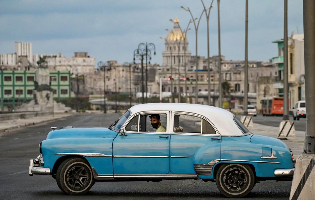 An old American car driving in the streets of Havana, Cuba