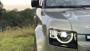 upclose shot of the headlight and front fascia of a new Land Rover Defender