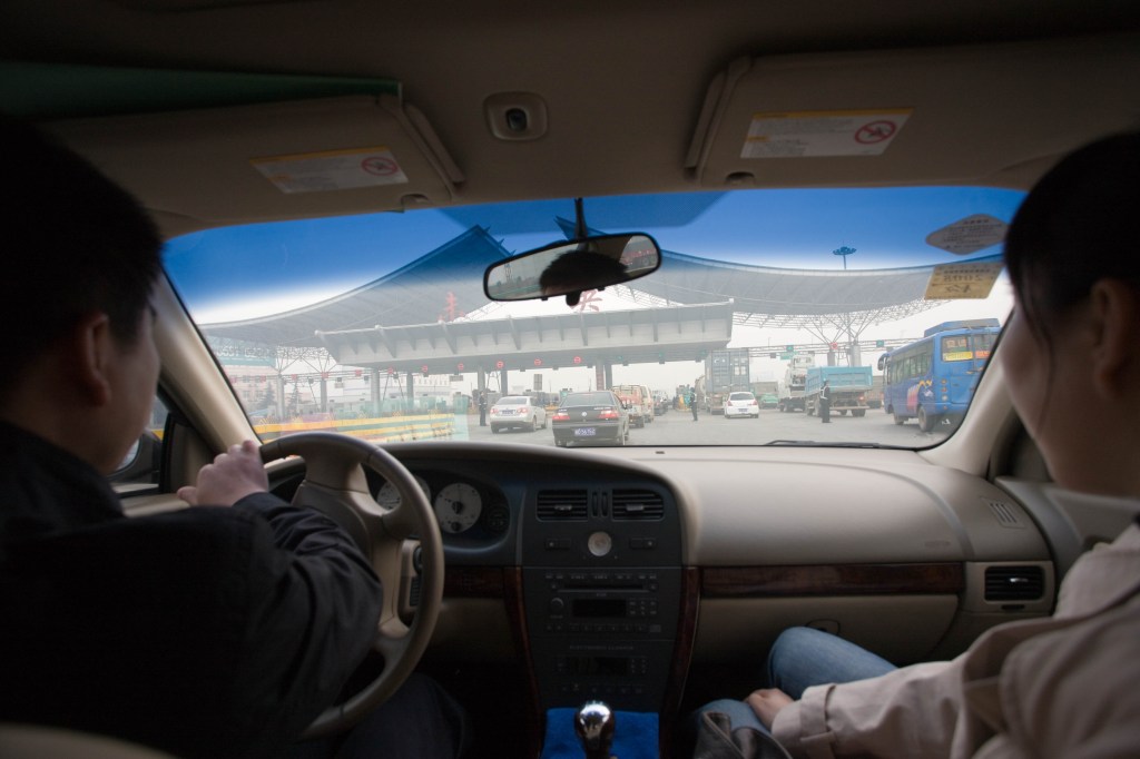 Driver And Passenger Riding In Car