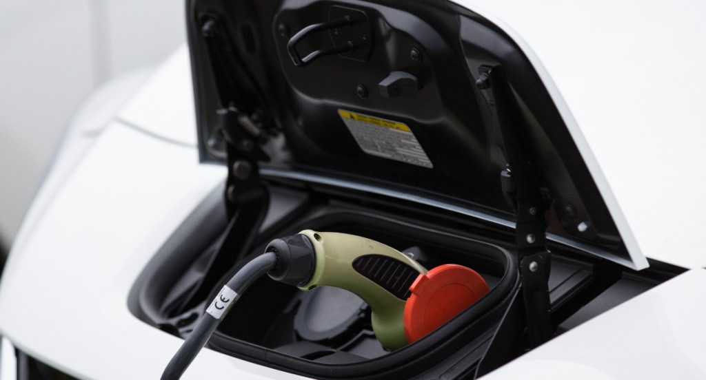 Electric vehicle connected to the charger seen in Lindholmen Science Park in Gothenburg.