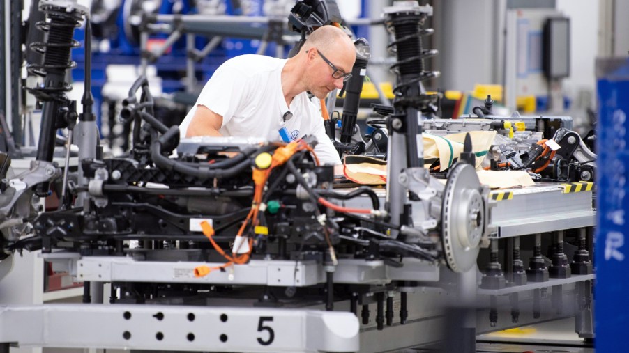 Volkswagen employees wire the battery on a line for the VW ID.3 during a press tour of Volkswagen's Transparent Factory. 35 all-electric vehicles are produced daily at the Dresden site.