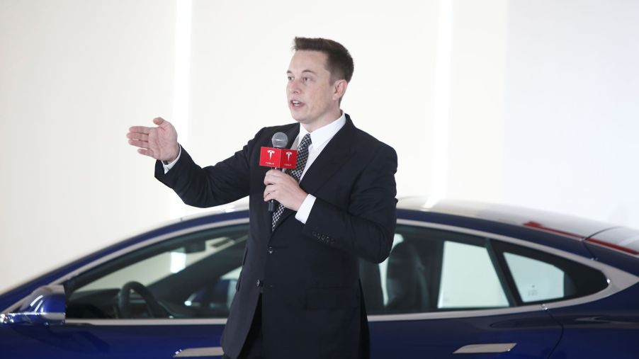 Elon Musk speaking during a press conference on Tesla self-driving capabilities