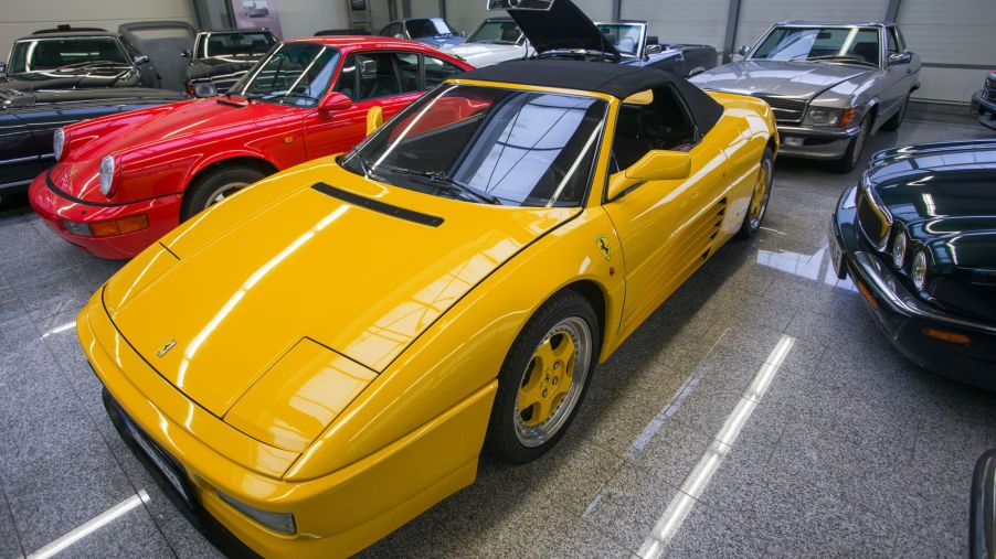 A yellow Ferrari 348 Spider model parked in a showroom in Pomerania, Germany