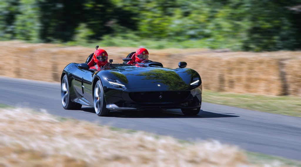 A black Ferrari Monza SP2 racing at the 2019 Goodwood Festival of Speed in Chichester, England