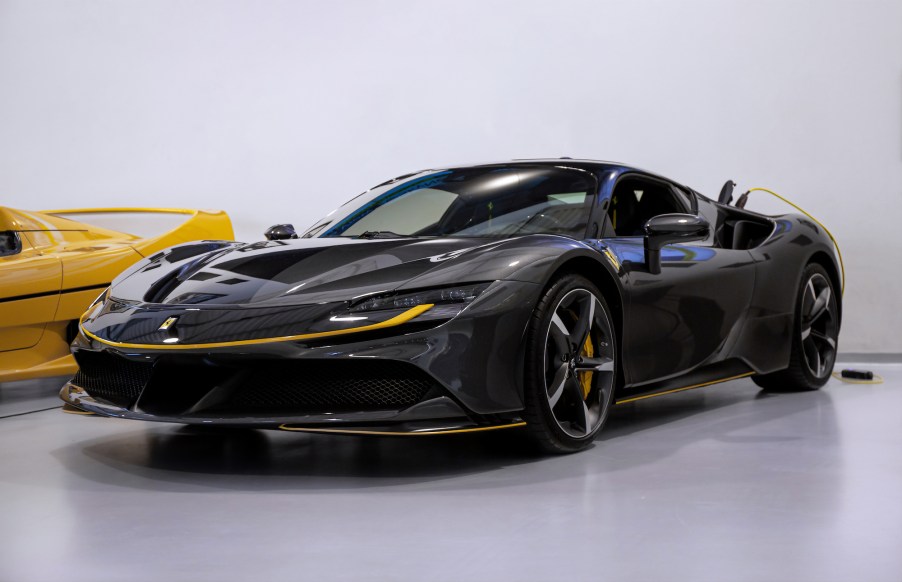 A dark-gray metallic Ferrari SF90 Stradale at Joe Macari Performance Cars in Wandsworth, London