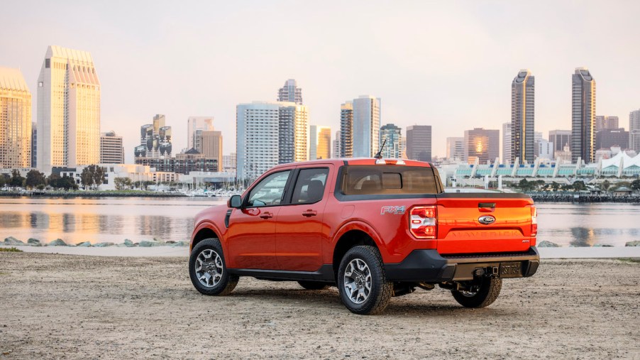 A 2022 Ford Maverick Lariat sits by the water across from a city skyline