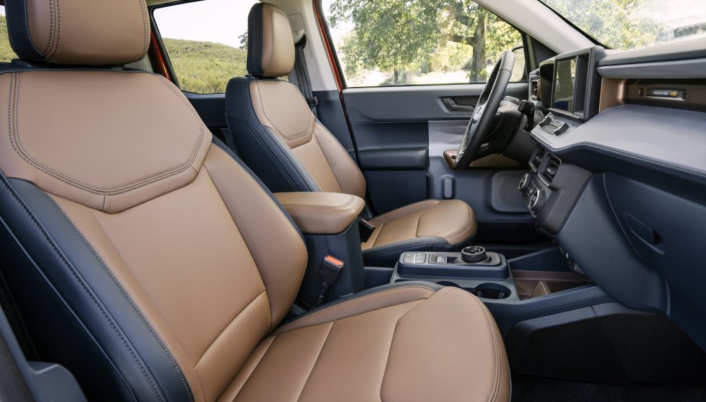 The interior of the new Maverick with a low center console and tan leather seats