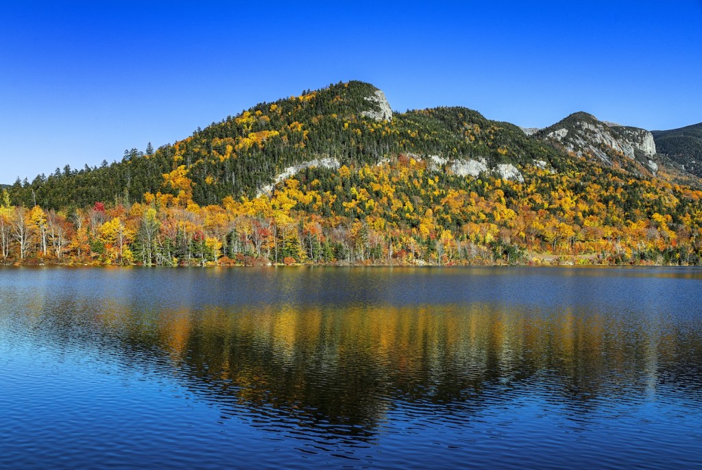 Autumn landscape at Echo Lake in Franconia Notch State Park in New Hampshire. one of the best RV campgrounds for fall foliage in New England