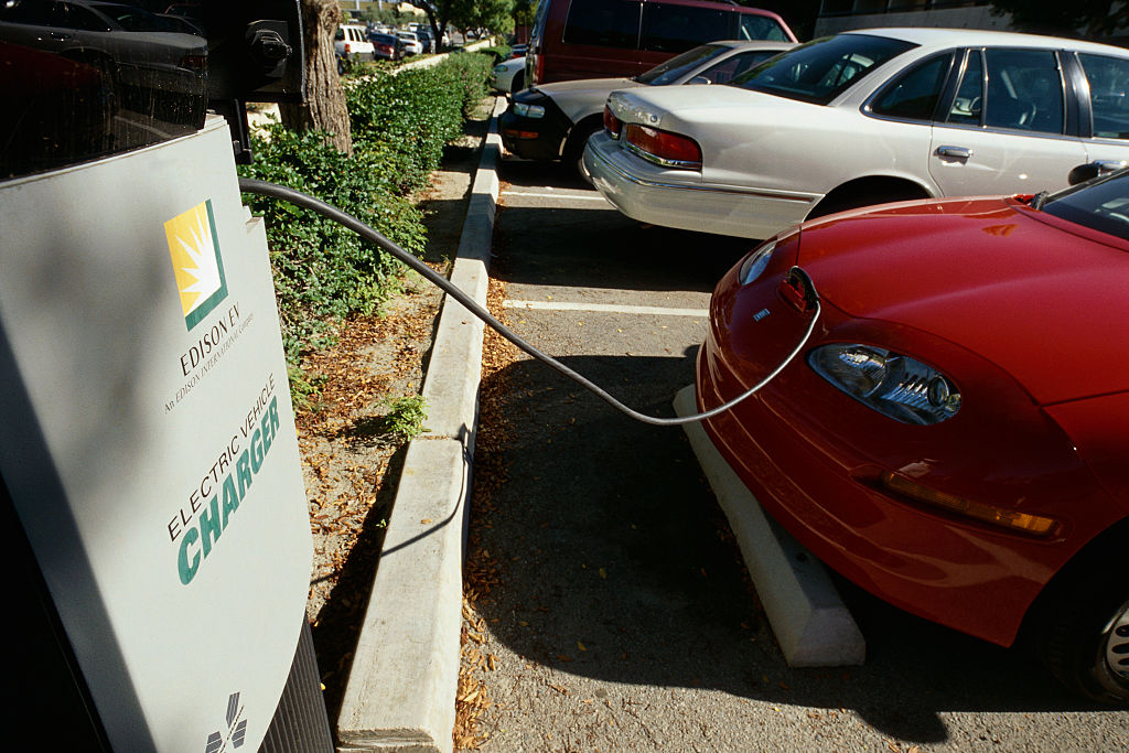 GM EV1 first mass-produced all-electric car being charged