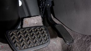 The gas and brake pedals in a Toyota vehicle from a lot in San Diego, California
