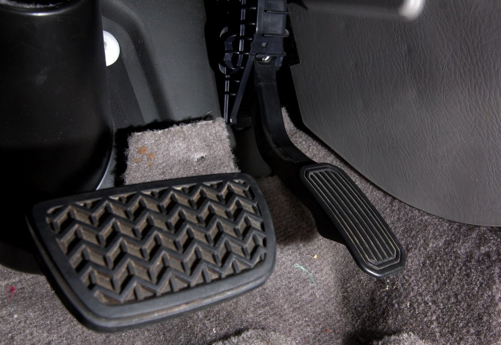 The gas and brake pedals in a Toyota vehicle from a lot in San Diego, California