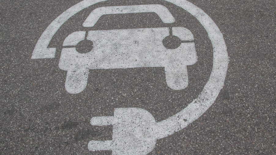 A symbol depicting a car and an outlet shown near an EV charger