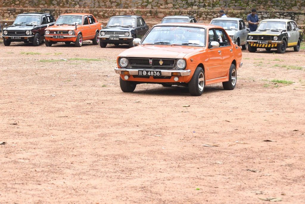 This photo taken on October 27, 2019 shows Toyota Corolla models from the 1970s during a car rally in Kadawatha on the outskirts of the Sri Lankan capital Colombo. (Photo by LAKRUWAN WANNIARACHCHI / AFP) (Photo by LAKRUWAN WANNIARACHCHI/AFP via Getty Images) What Is The Best Selling Car Of All Time?