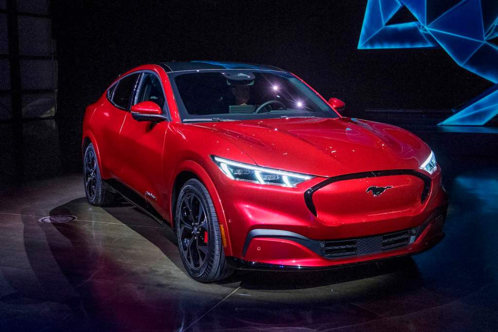 A red Ford Mach-E at the SUV's unveiling. The Ford Mach-E is one of the best Electric SUVs of 2021