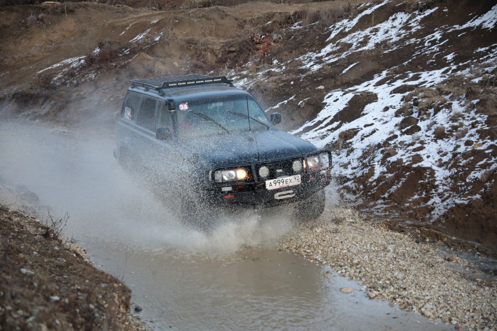 A modified SUV participates in an off-road rally in Russia