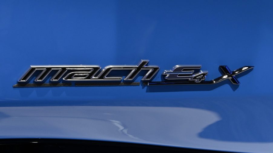 The badge on the blue Ford Mustang Mach E