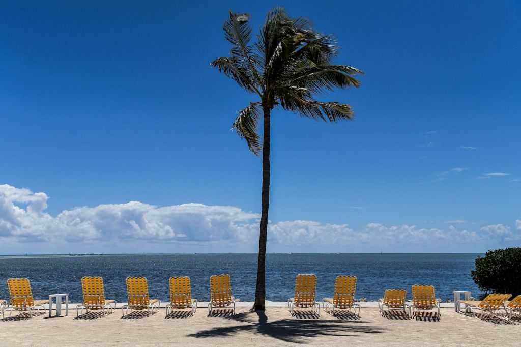 TOPSHOT - Empty lounge chairs are seen on a deserted beach at a resort in Windley Key, on March 22, 2020, during the coronavirus (COVID-19) outbreak. - The Florida Keys have closed down to visitors. Heavily relying on tourism, at the peak of high season, Florida's most southern holiday islands have been forced to shut down hotels amid the COVID-19 pandemic. (Photo by CHANDAN KHANNA / AFP) (Photo by CHANDAN KHANNA/AFP via Getty Images) Hailing from Palm Beach, a 2020 Ford Shelby GT500 Mustang beats Tesla Model S plaid in a drag race.